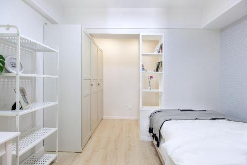 Krevet ili kreveti u jedinici u objektu Wuhan Wuchang·Hualin Huabu Lane· Locals Apartment 00142780