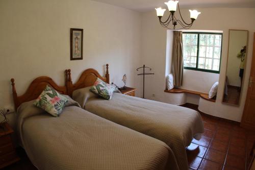 En eller flere senger på et rom på Casa La Majada
