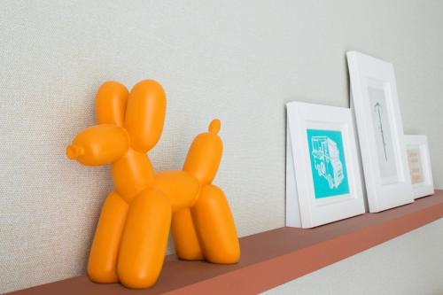 a shelf with a orange teddy bear on it at Hyatt Centric Times Square New York in New York