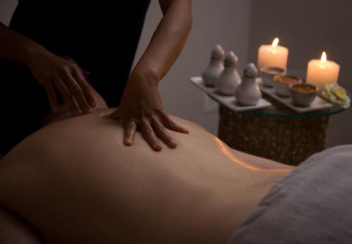 a woman getting a back massage on her stomach at Damrei Residence & Spa in Siem Reap