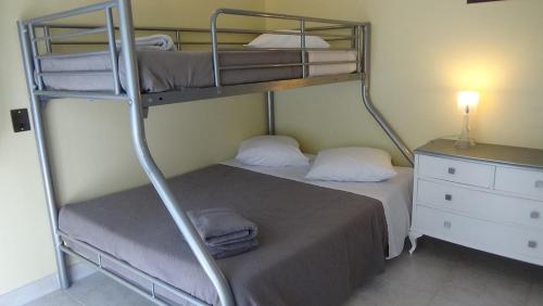 Poschodová posteľ alebo postele v izbe v ubytovaní Casa Fontanella
