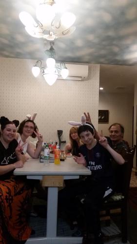 a group of people sitting at a table with rabbits on their heads at Tokyo Guest House 2020 in Tokyo