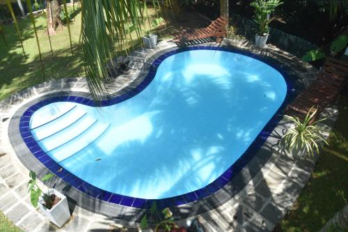an overhead view of a swimming pool with stairs around it at Sethra Villa Bentota in Bentota