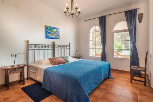 En eller flere senge i et værelse på Villa El Ancla