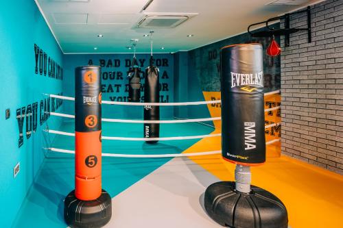 a pair of boxing equipment in a boxing ring at Mandachi Hotel & SPA in Suceava