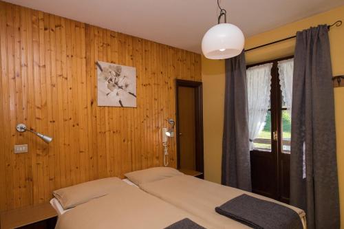 Postel nebo postele na pokoji v ubytování Albergo al Forte