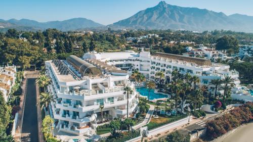 a large building with a clock on top of it at Iberostar Selection Marbella Coral Beach in Marbella