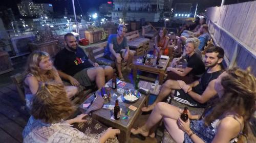 a large group of people sitting at a table at Tiberias Hostel in Tiberias