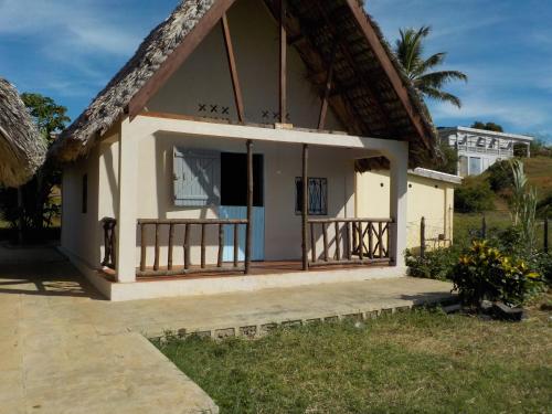 a small house with a thatched roof at SANJEELA-PLAGE COCO in Diego Suarez