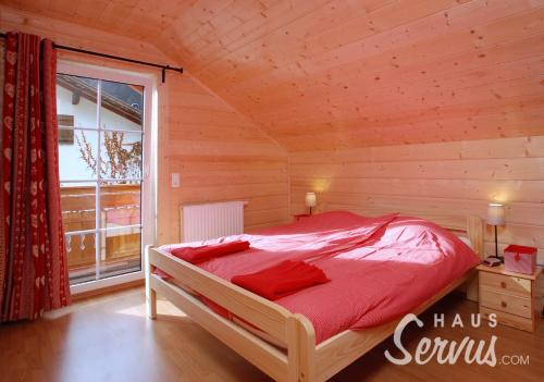 Postel nebo postele na pokoji v ubytování Haus Servus