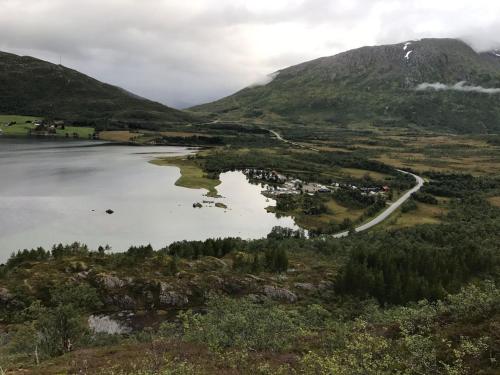 a view of a lake in a valley with mountains at Gullesfjord Camping in Gullesfjord