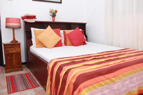 Llit o llits en una habitació de Jumera Villa Mirissa