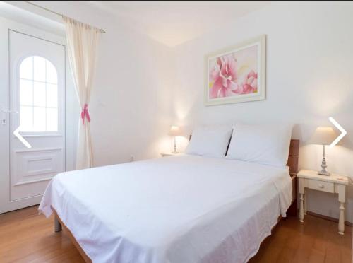 Postel nebo postele na pokoji v ubytování Apartments Mak