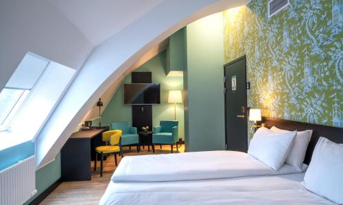מיטה או מיטות בחדר ב-Thon Hotel Maritim