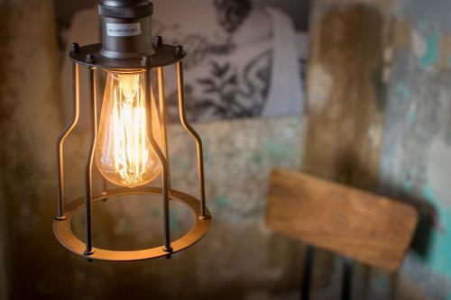 a light that is hanging from a ceiling at Kochs Stadthotel in Olpe
