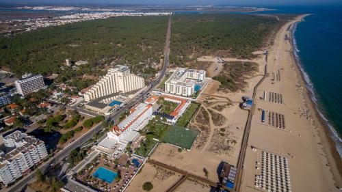 an aerial view of a beach and buildings at Hotel Vasco Da Gama in Monte Gordo
