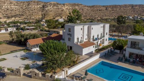 an aerial view of a villa with a swimming pool at Paradise Matala Hotel in Matala