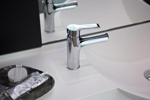 a bathroom sink with a chrome faucet at The Z Hotel Covent Garden in London
