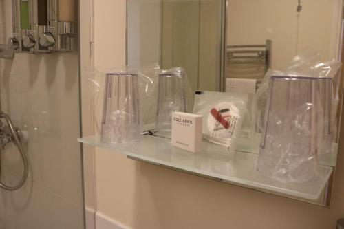 a shelf in a bathroom with plastic bags on it at Gonalston Boutique B&B in Lowdham