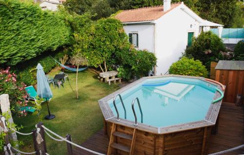 an overhead view of a swimming pool in a backyard at Moinho do Prado in Vila Nova de Cerveira