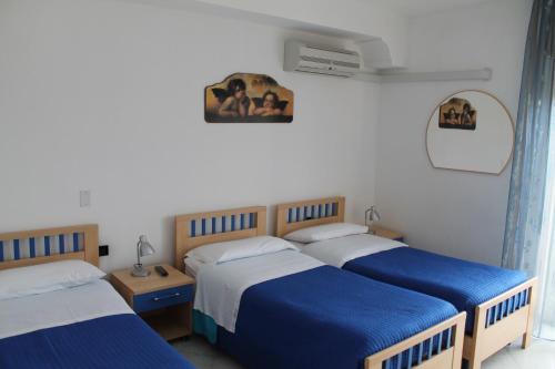 Postel nebo postele na pokoji v ubytování B&B Brezza Marina & Ristorante Shoreline
