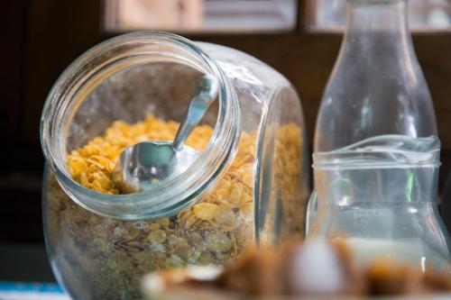 a jar of food with a spoon in it at Destino26 Hostel in Montevideo