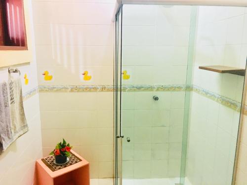 a shower with a glass door in a bathroom at Casa Jeri in Jericoacoara