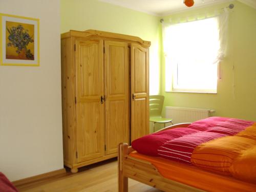 מיטה או מיטות בחדר ב-Ferienwohnung Moos-Hochsauerland