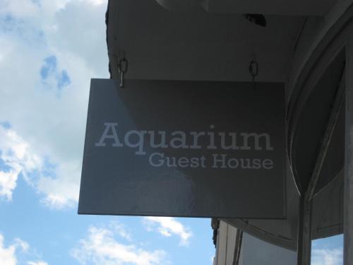 a sign for a guest house at a building at Aquarium Guest House in Brighton & Hove