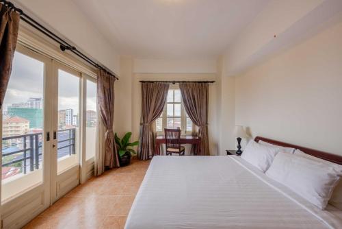 מיטה או מיטות בחדר ב-City View Apartment