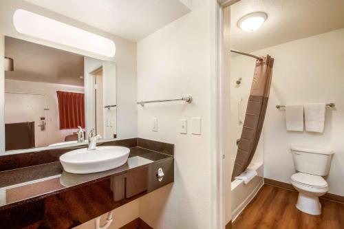 a bathroom with a white sink and a toilet at Motel 6-Youngtown, AZ - Phoenix - Sun City in Youngtown