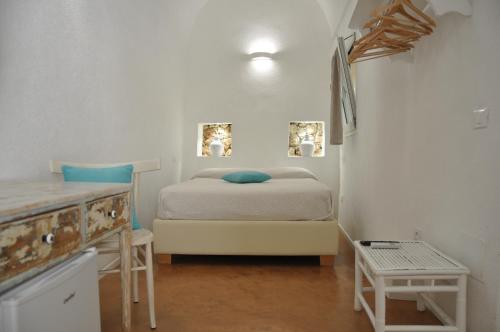 Posteľ alebo postele v izbe v ubytovaní Vico degli Ebrei - Rooftop Jacuzzi - self check-in