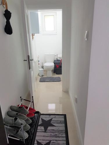a hallway with a bathroom with a toilet at Luxury Apartment in Ramingstein