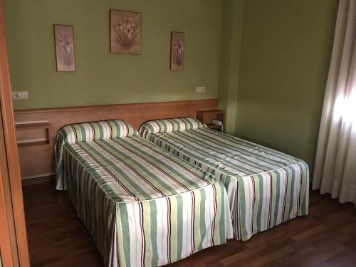 Ένα ή περισσότερα κρεβάτια σε δωμάτιο στο Hotel Maruja Nozana