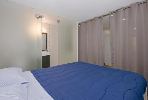 Łóżko lub łóżka w pokoju w obiekcie Lisbon DownTown (Mouraria)