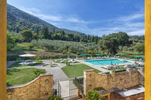 a view of a resort with a swimming pool at Hotel Villa Cheli in Lucca