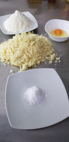 a white plate with sugar and other ingredients on a table at ROOMS balani in Shkodër