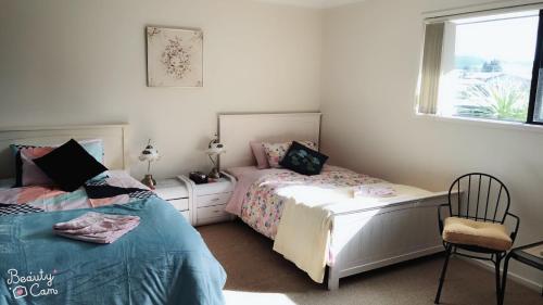 Ένα ή περισσότερα κρεβάτια σε δωμάτιο στο Super Lake Edge Lodge