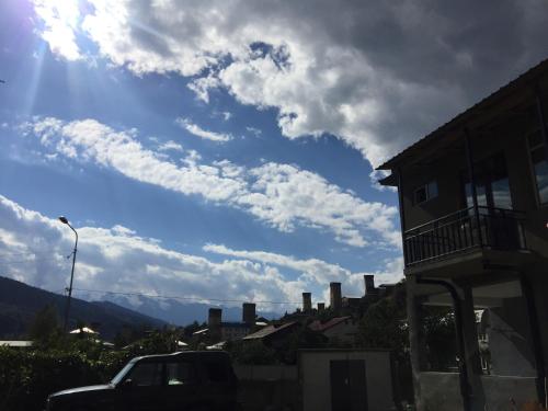 a view of a cloudy sky with a building at Teona's Guesthouse in Mestia in Mestia