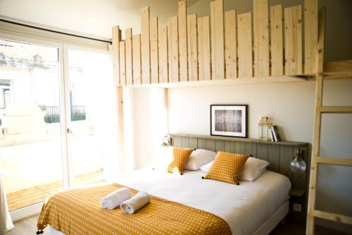 Ένα ή περισσότερα κρεβάτια σε δωμάτιο στο Georges Hostel & Café