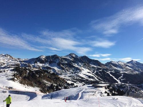 a person is skiing down a snow covered mountain at Riverside Ski Apartment in Ramingstein