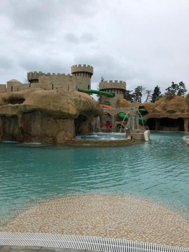a water park with a castle in the water at Dreamland oasis in Chakvi in Chakvi