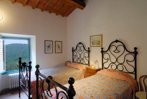 מיטה או מיטות בחדר ב-"Alle Montanine" Sughera