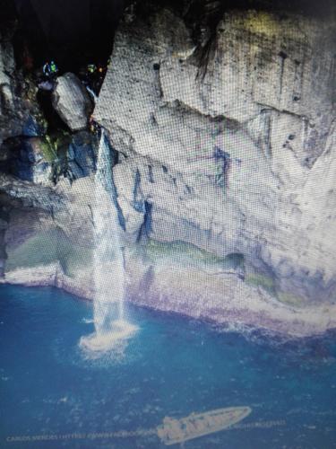 a waterfall in the middle of a pool of water at Casa vicente in Santa Cruz das Flores