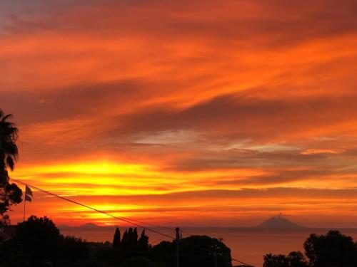a sunset view of the ocean with at Appartamenti Borgo Panoramico n.1 in Tropea