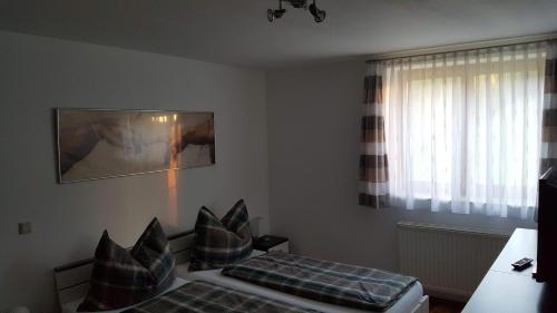 a small room with a bed and a window at ferienhausfindling St.Lambrecht in Sankt Lambrecht