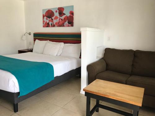 Cama o camas de una habitación en Sandyland Reef Inn
