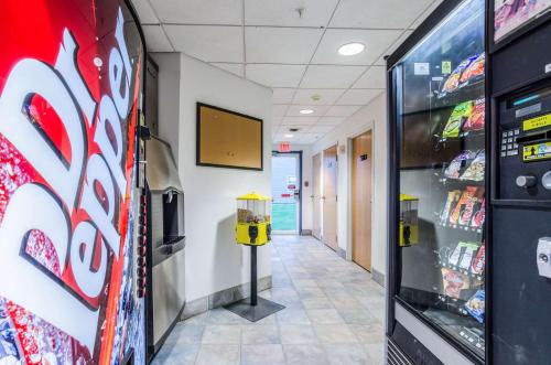 a hallway of a store with a soda machine at Motel 6-Kearney, NE in Kearney