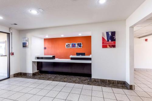 an empty lobby with a reception desk in a building at Motel 6-Troy, IL in Troy