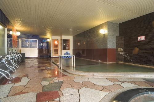 a large pool of water in a building with at Hotel Grand Toya in Lake Toya